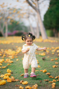 Full length of cute baby girl running on land