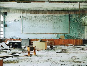 Broken table in abandoned building