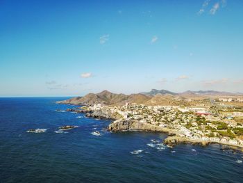 Scenic view of sea against clear blue sky