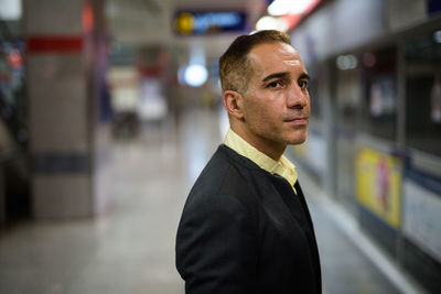 Man standing at railroad station