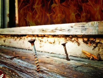 Close-up of rusty metal against wall