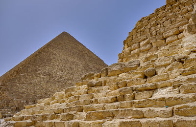 Stone wall against clear sky