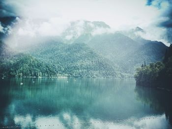 Scenic view of lake with mountains in background