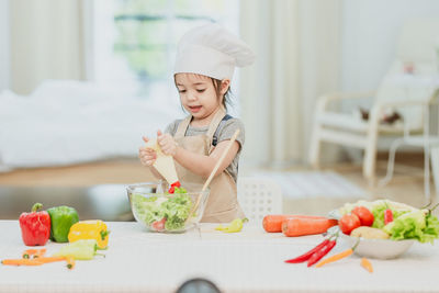 Midsection of man preparing food in kitchen