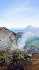 Scenic view of volcanic landscape against sky