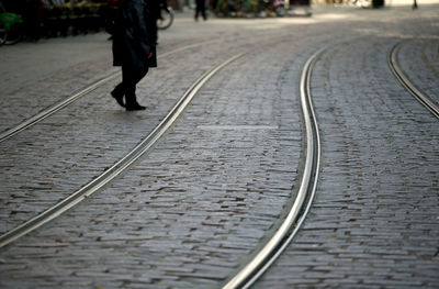 Low section of person walking on tramway