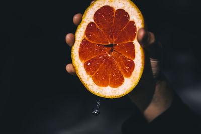 Close-up of lemon slice against black background