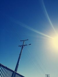 Low angle view of birds flying against sky