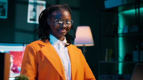 Portrait of young man standing in city