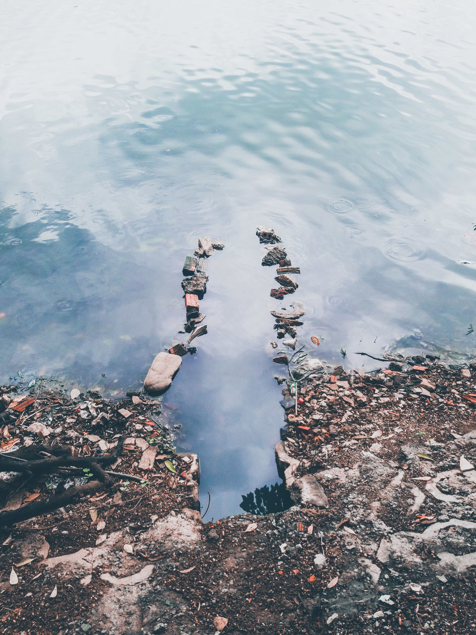 LOW SECTION OF PERSON ON LAKE