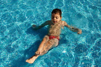 High angle view of man swimming in pool