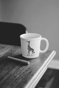 Close-up of coffee cup on table