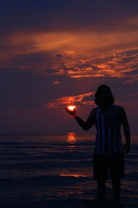 Scenic view of sea at sunset