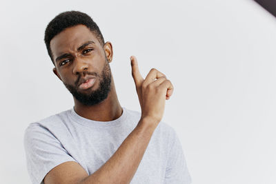 Young man against white background