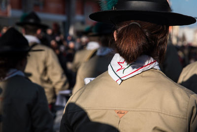 Rear view of man wearing hat in city