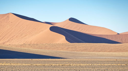 Scenic view of desert against clear sky