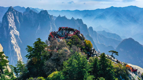 Panoramic view of trees and mountains against sky