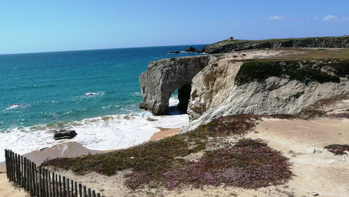 Scenic view of beach against clear sky