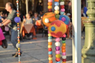 Close-up of colorful decorations hanging outdoors