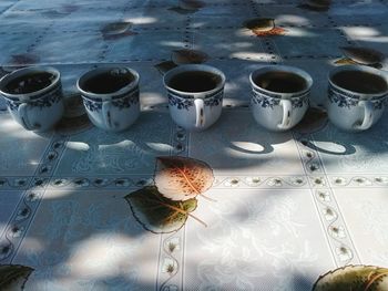 High angle view of coffee and potted plant