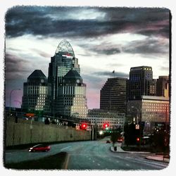 City skyline against cloudy sky