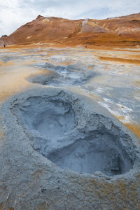 View of volcanic landscape against sky