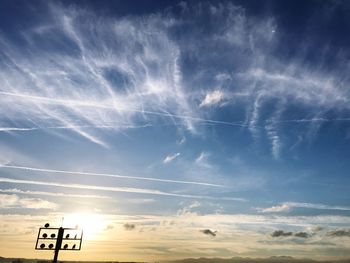 Low angle view of road sign against sky