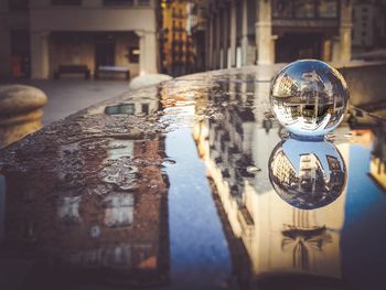 Upside down image of traditional building by water