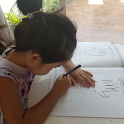 High angle view of girl on table