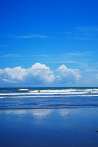 Scenic view of sea against blue sky