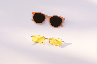 High angle view of sunglasses against white background