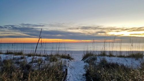 Scenic view of sea against sky during sunset