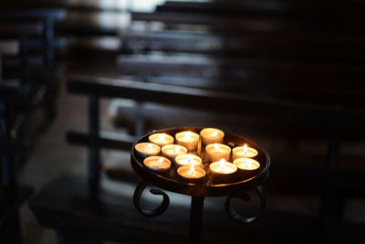 Close-up of illuminated tea light candles at night