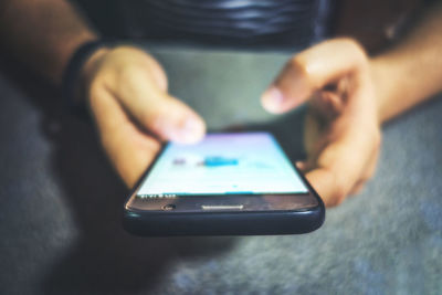 Close-up of man using mobile phone