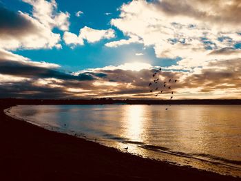 Scenic view of sea against sky at sunset