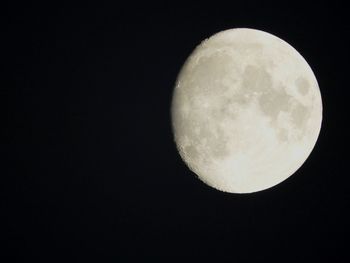 Low angle view of moon against clear sky at night