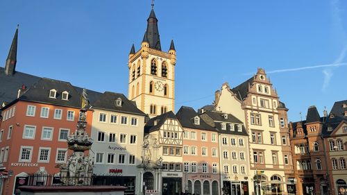 Low angle view of buildings in city against sky