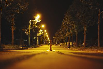 Illuminated street lights at night