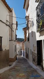 Alley amidst buildings in city