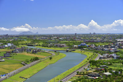 High angle view of buildings in city against sky