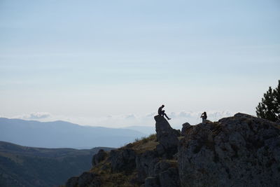 Scenic view of mountains against cloudy sky