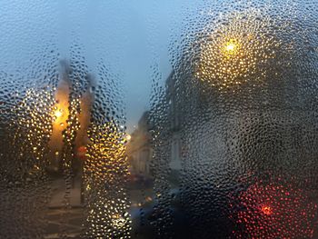 Raindrops on glass window during rainy season