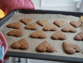 Close-up of heart shape cookies on baking sheet