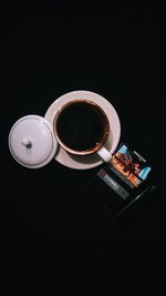 High angle view of coffee on table against black background