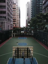 High angle view of basketball court against buildings in city