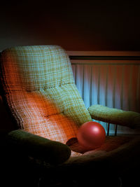 Close-up of illuminated ball on table at home