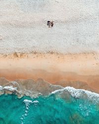 High angle view of people on sea shore