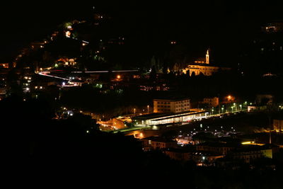 High angle view of illuminated buildings in city at night