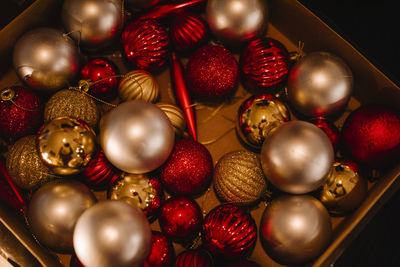 Close-up of various christmas baubles in box