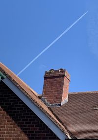 Low angle view of building against blue sky